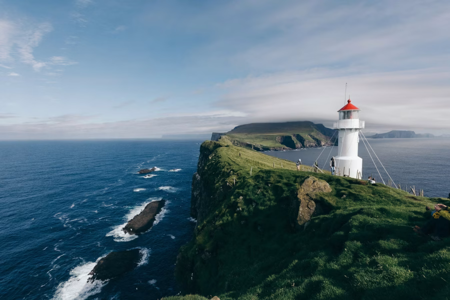 Dramatic cliffs and lighthouse on Mykines, Puffin Island in the Faroe Islands